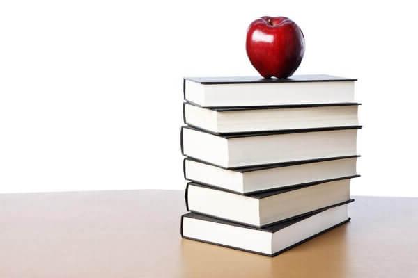 Stack of books with an apple on top